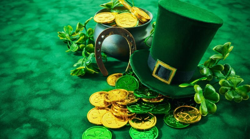 St. Patrick's Day Treasures. Green hat with gold coins, lucky clovers, and a pot