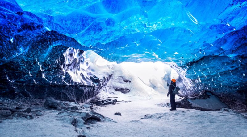 Traveler in ice cave