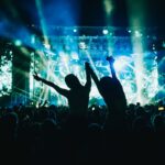 Two woman in the crowd at a music festival