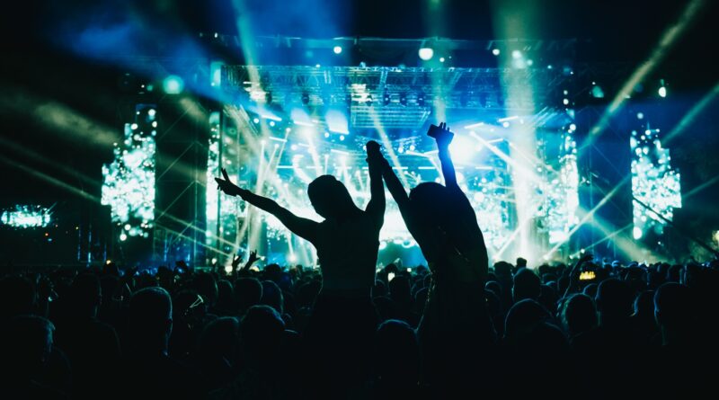 Two woman in the crowd at a music festival